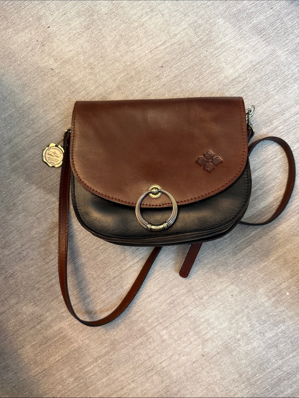 Patricia Nash Brown and Black Two-Tone Leather Crossbody with Gold Ring Accent